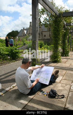 Artist in the Physic Garden Cowbridge Vale of Glamorgan South Wales UK Stock Photo