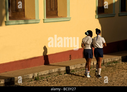 Cuban schoolgirls heading off in the morning. Trinidad, Cuba Stock Photo