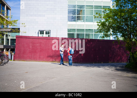 Two students talking on the Campus of the National University of Ireland, Galway Stock Photo