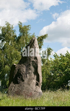 Standing stone from the Iron age in a green field. Stock Photo