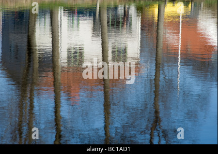 Houses reflected in a river, Kungsbacka, Sweden Stock Photo