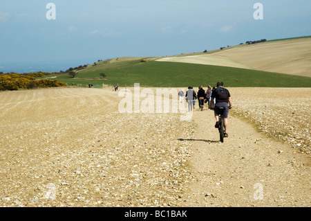 Walkers and cyclist on the South Downs Way, Sussex Stock Photo