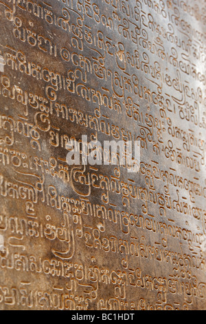 Ancient Sanskrit text on stone wall of Lolei temple ruins, [Roluos Group], Angkor, Cambodia Stock Photo