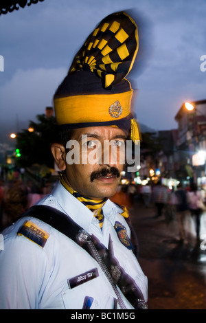 Policeman of the Shimla police service – in traditional dress – on street duty. Shimla. Himachal Pradesh. India. Stock Photo