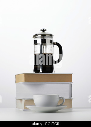 coffee cafetiere on books Stock Photo