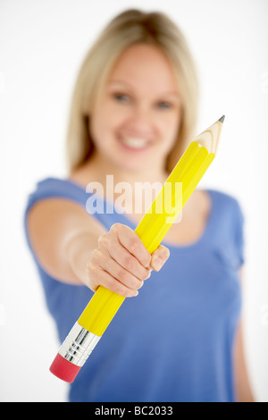 Woman Holding Big Pencil Stock Photo