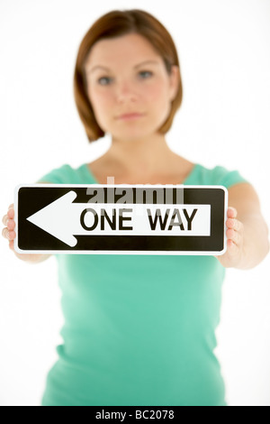 Woman Holding Road Traffic Sign Stock Photo