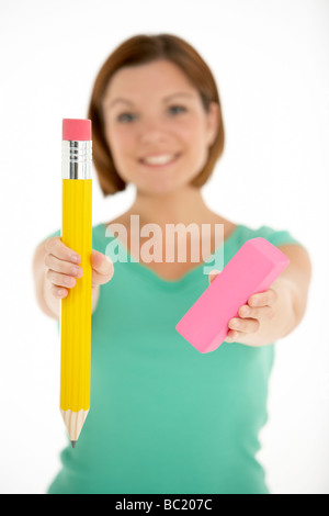 Woman Holding Big Pencil And Eraser Stock Photo