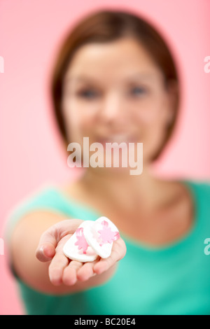 Woman Holding Small Beach Sandals Stock Photo