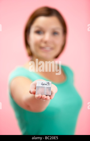 Woman Holding Small Gift Stock Photo