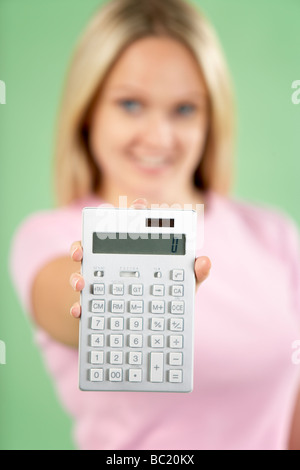 Woman Holding Calculator Stock Photo