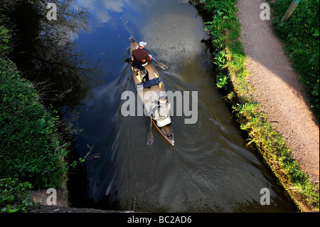 canoeists enjoy the tranquil waters of the Grand Western Canal near Tiverton Devon Stock Photo