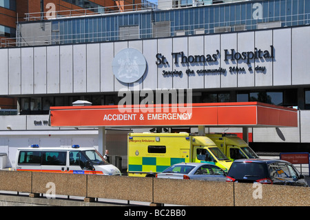 NHS accident and emergency ambulances & police car at hospital building ...