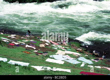 Washing spread on the ground to dry at side of River Nile Bujagali Falls Uganda East Africa Stock Photo