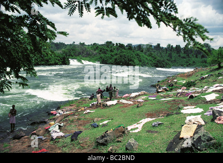 Washing spread on the ground to dry at side of River Nile Bujagali Falls Uganda East Africa Stock Photo