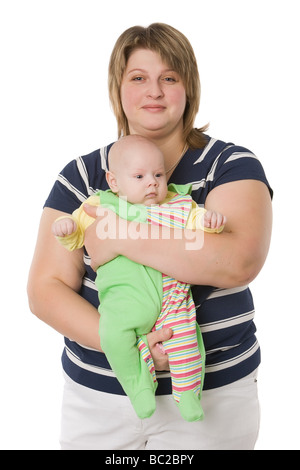 Mum holds toddler before itself embracing hands isolated on white