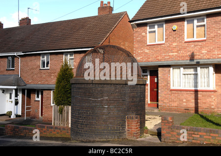 Canal ventilation shaft in the garden of a house in Station Road Old Hill Dudley Stock Photo