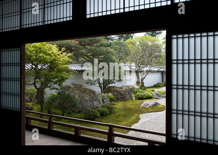 Looking from inside through open shoji screens to the landscape garden and raked gravel garden at Nanzenji Temple in Kyoto Stock Photo