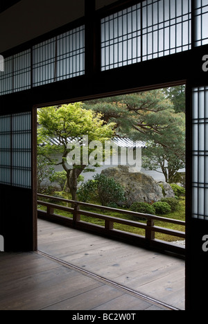 Looking from inside through open shoji screens to the green landscaped garden outside at Nanzenji Temple in Kyoto Stock Photo