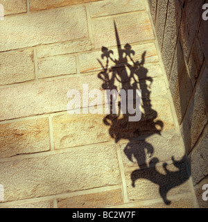 The street lamp shadow on the stone wall Stock Photo