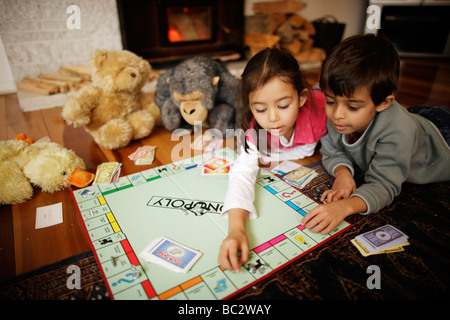 Children play Monopoly Stock Photo