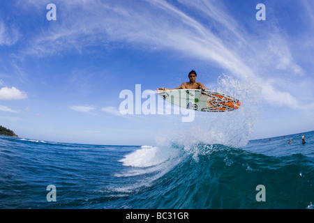 Water shot of surfer doing a frontside air in the Dominican. Stock Photo
