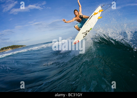 Water shot of surfer doing a frontside air in the Dominican. Stock Photo