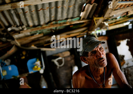 A fisherman sits in his shack on Cubagua Island, Venezuela. Stock Photo