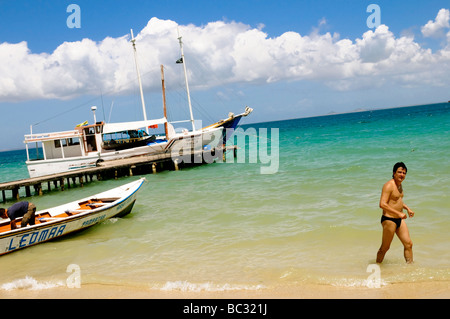 Adult male tourist enjoys the beach on the Caribbean Island of Cubagua in Venezuela. Stock Photo