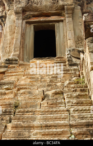 Carved stone steps leading up to door at top of temple tower, [Angkor Wat], Cambodia