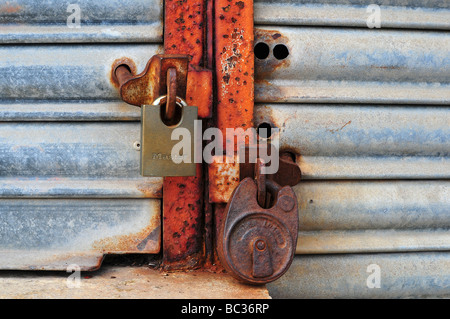 Padlocks on a closed shop Stock Photo