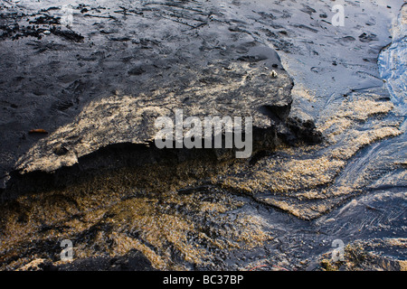 The sand of Pantai Pasir Hitam - black sand beach - on Langkawi Island Stock Photo