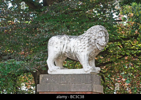 Antique stone lion stands guard on the famous walls of Lucca in Tuscany,Italy, Stock Photo