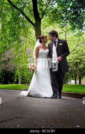 couple newly alamy talking married walk through park photographs