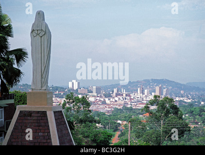Statue of Virgin Mary at Roman Catholic Cathedral overlooking modern capital city of Kampala Uganda East Africa Stock Photo