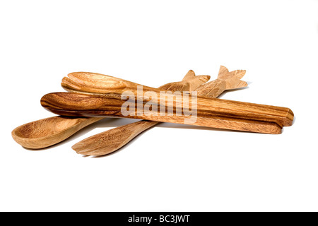 Close-up of carved wood spoons on white background Stock Photo