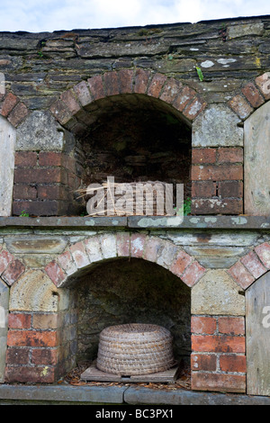 Brick & stone Antique beehives in the Walled garden of Heligan, near Mevagissey, St Austell, Cornwall, UK Stock Photo