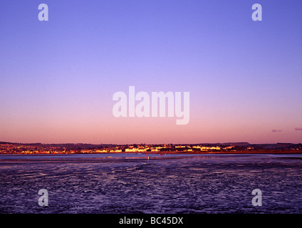 torbay estuary duing a sunset with sea boats in harbour shot from the railway Stock Photo