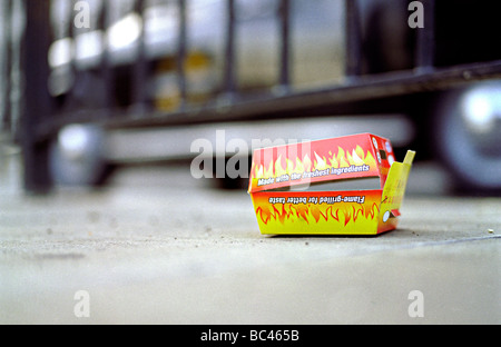 disgarded fast food wrapper in the street Stock Photo