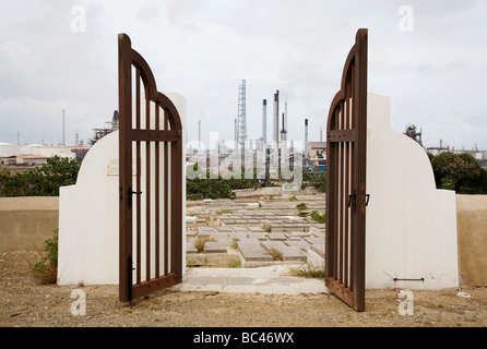 Entrance of Jewish cemetery and view of oil refinery Willemstad Curacao Stock Photo