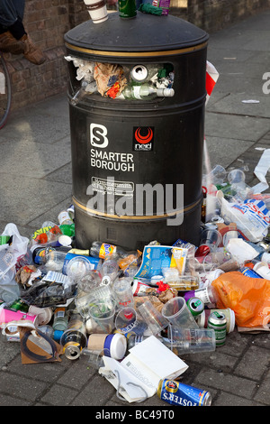 Overflowing rubbish bin in London UK Stock Photo