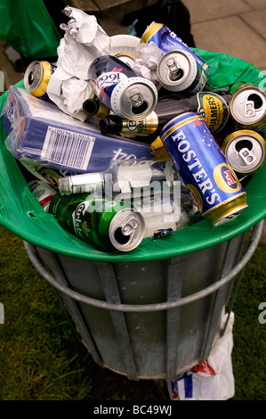 A trash can overflowing with beer cans and bottles collected by Metro ...