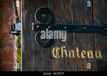 CHATEAU WINERY DOOR ENTRANCE Ancient historic open wooden entrance door to typical French wine Chateaux Stock Photo