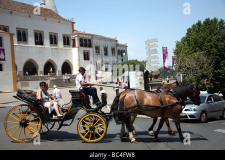 Horse & carriage with tourists in front of the Palacio Nacional de Sintra Stock Photo