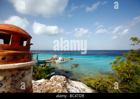 View over the ocean from the Caribbean isle Curacao in the Netherlands Antilles. Model lighthouse and blue sea are visible Stock Photo