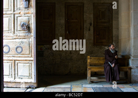 Franciscan Priest at the Church of the Holy Sepulchre in Jerusalem Stock Photo