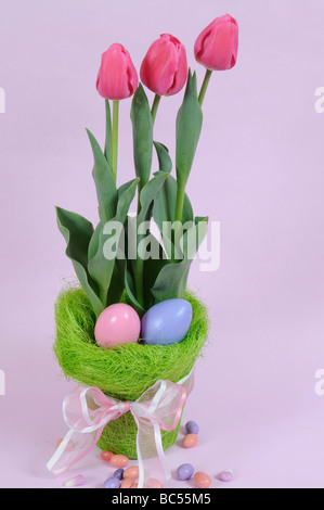 Tulips and Easter Eggs with Candy Stock Photo