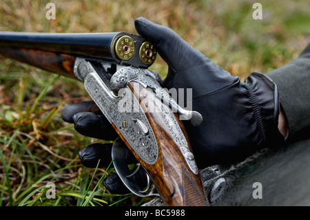 Holland and Holland English Best Shotgun with Open Breech and Loaded Shells in the Highlands of Scotland