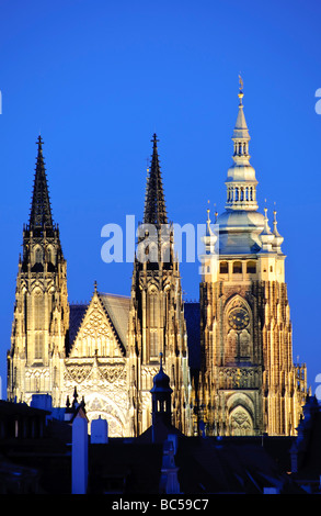 PRAGUE, Czech Republic - Prague Castle at dusk. The iconic Prague Castle, a symbol of Czech history and power, stands majestically on a hill overlooking the city. It is the largest ancient castle in the world and a UNESCO World Heritage site, drawing countless visitors each year to explore its captivating history and architectural diversity. Stock Photo