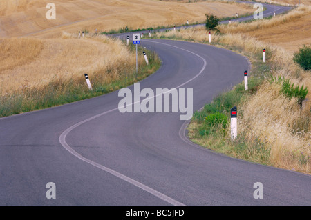 Italy, Tuscany, Road and Field landscape Stock Photo